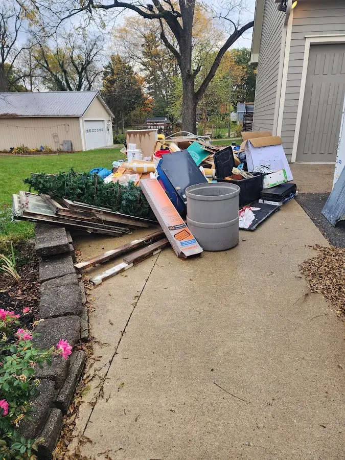 Dumpster being loaded with debris for Residential Dumpster Rental in Glasgow